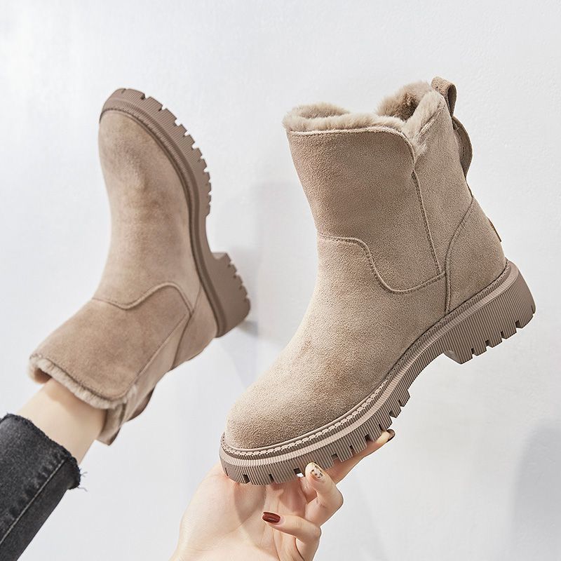 Fur-Lined Winter Ankle Boots with Side Zip – Women – Beige – in hand