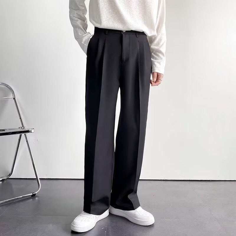Wide-Leg Pleated Trousers, Fluid Drape – Men – Black – worn