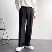 Wide-Leg Pleated Trousers, Fluid Drape – Men – Black – worn