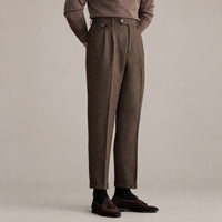 The Camel Coat — Old Money Winter Look – brown herringbone pleated trousers worn